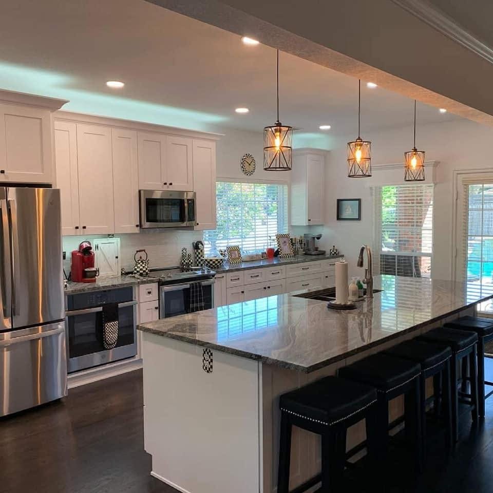 Luxury kitchen with blue roma quartzite countertop island and full marble backsplash